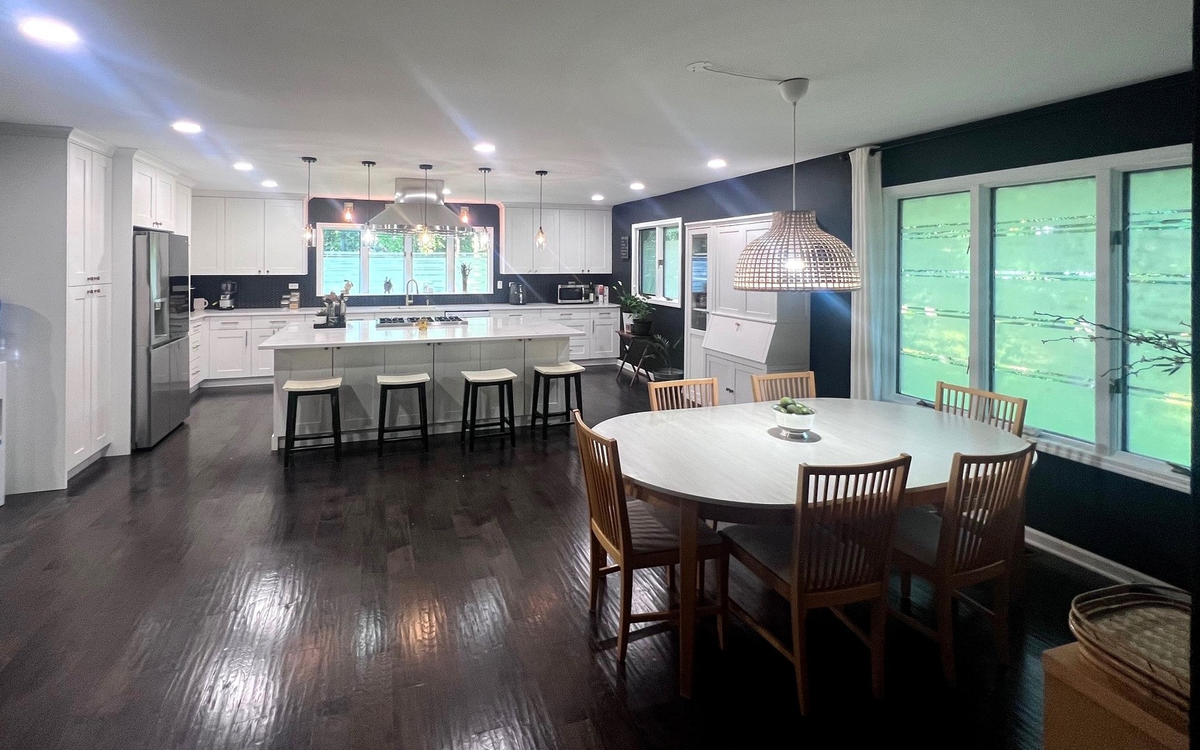 12970 Briody Way Genoa, IL 60135 - Photo 8 of 45 a kitchen with a table chairs refrigerator and microwave