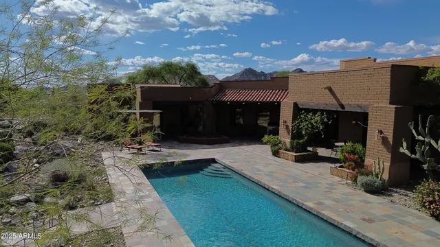 a open kitchen with stainless steel appliances granite countertop a stove and a refrigerator