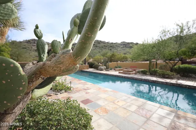a view of a hallway with wooden floor and dining room