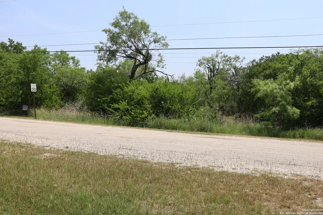 a view of a road with a yard