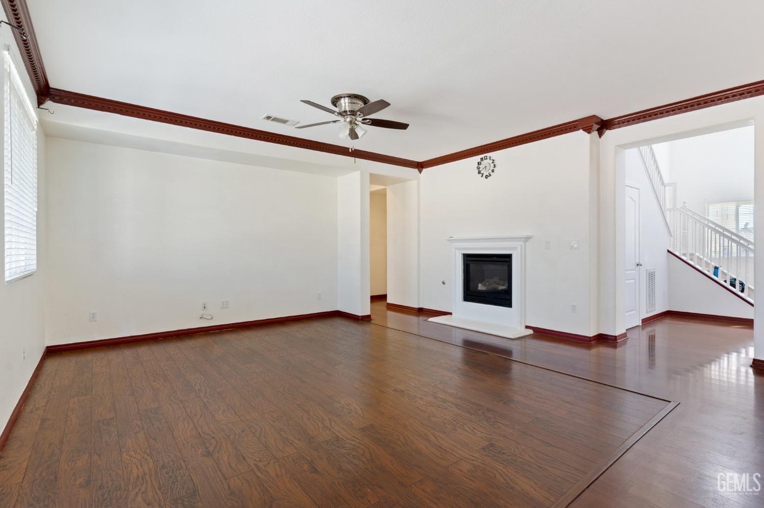 Undisclosed Address Bakersfield, CA 93306 - Photo 11 of 30 a view of an empty room with wooden floor and a window