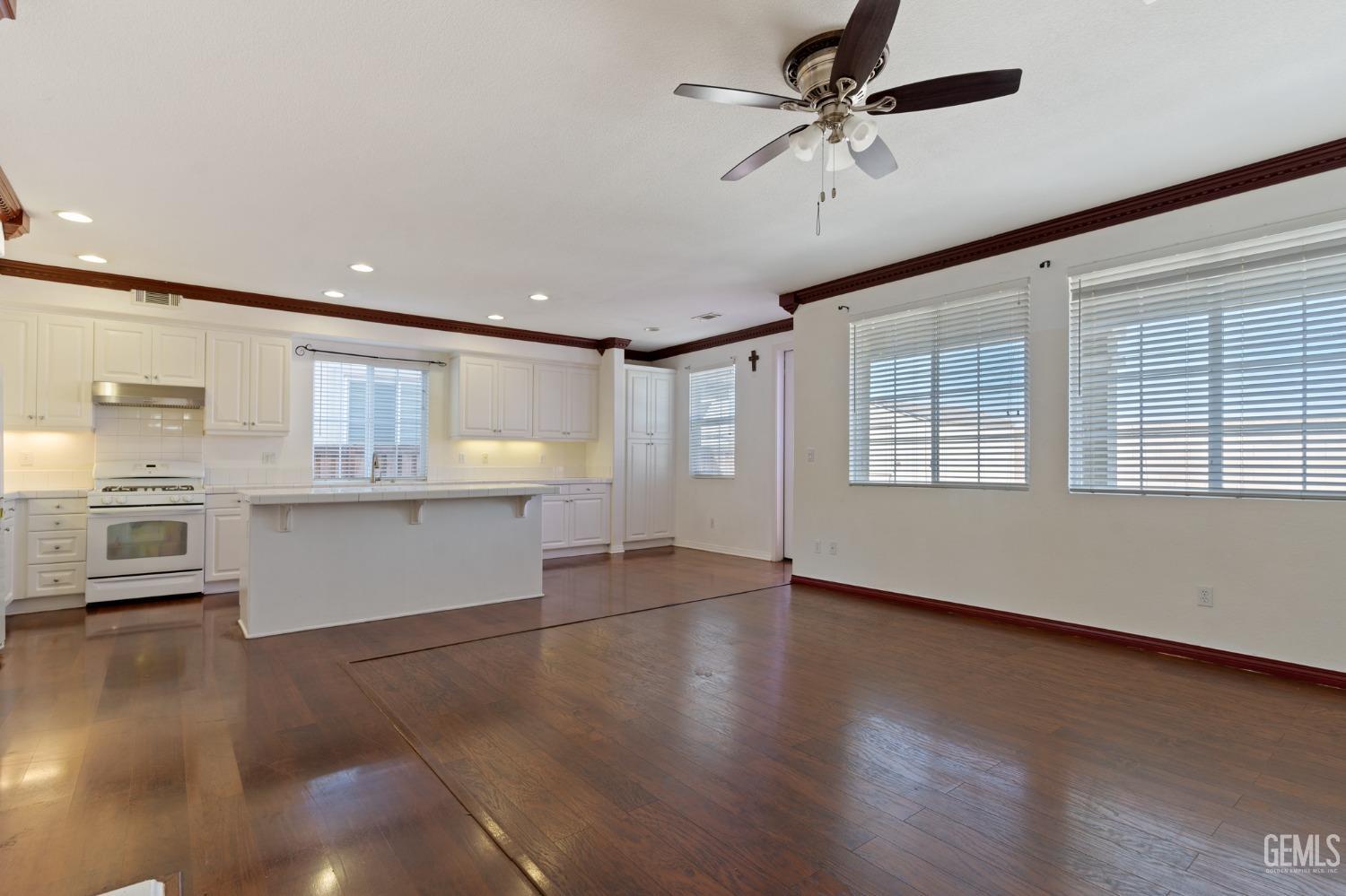Undisclosed Address Bakersfield, CA 93306 - Photo 15 of 30 a view of an empty room with a window and wooden floor