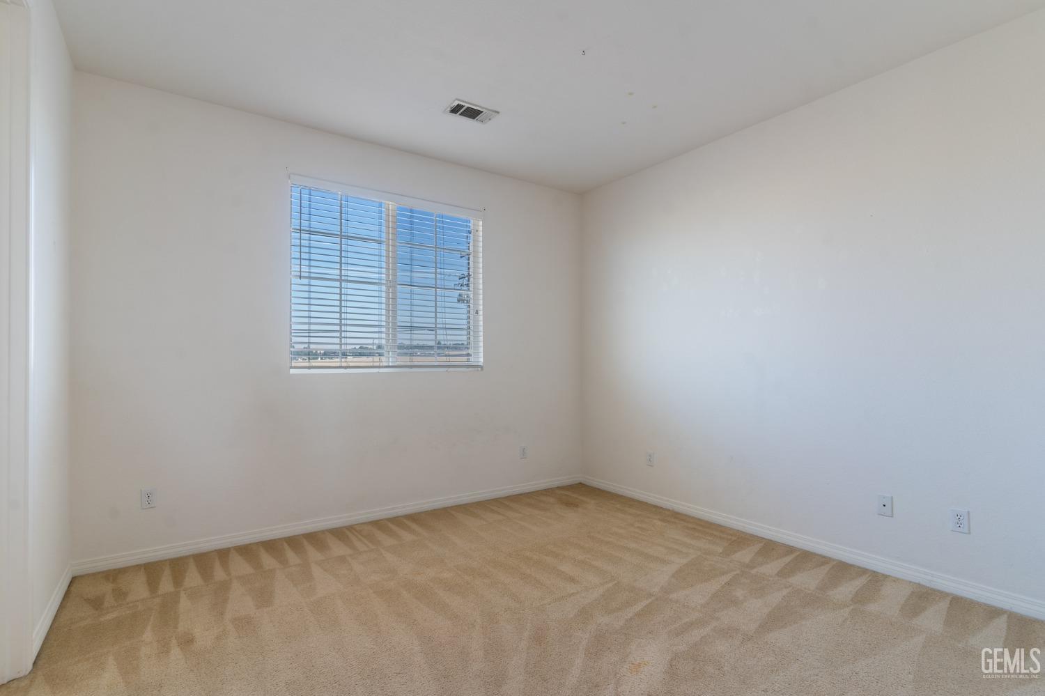 Undisclosed Address Bakersfield, CA 93306 - Photo 22 of 30 an empty room with a window