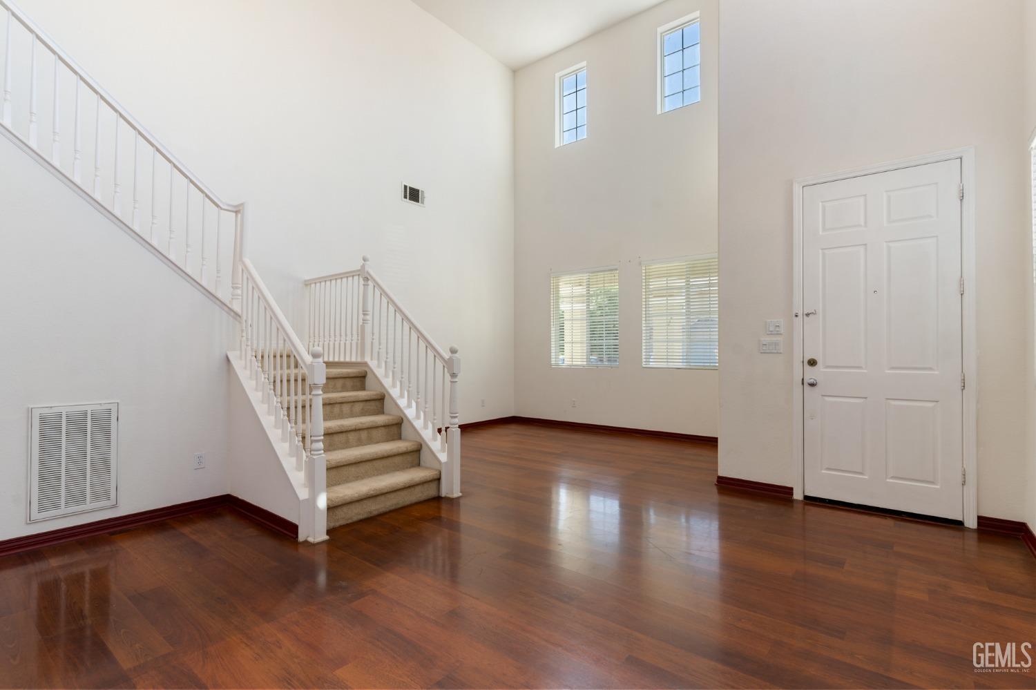Undisclosed Address Bakersfield, CA 93306 - Photo 4 of 30 a view of a room with wooden floors and white walls