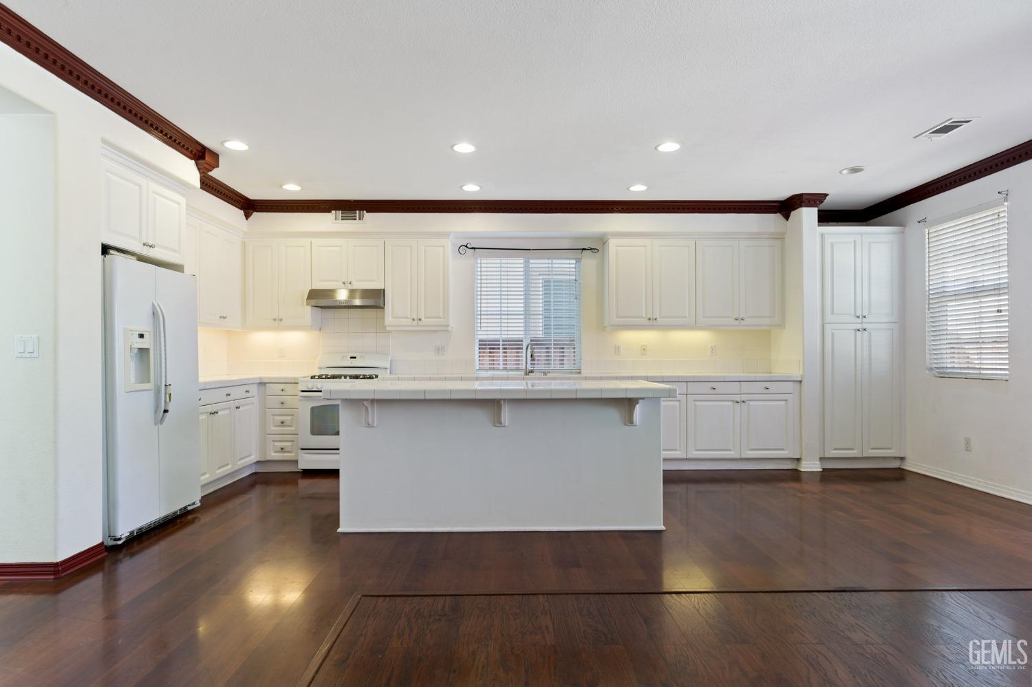 Undisclosed Address Bakersfield, CA 93306 - Photo 7 of 30 a kitchen with stainless steel appliances granite countertop a sink and cabinets