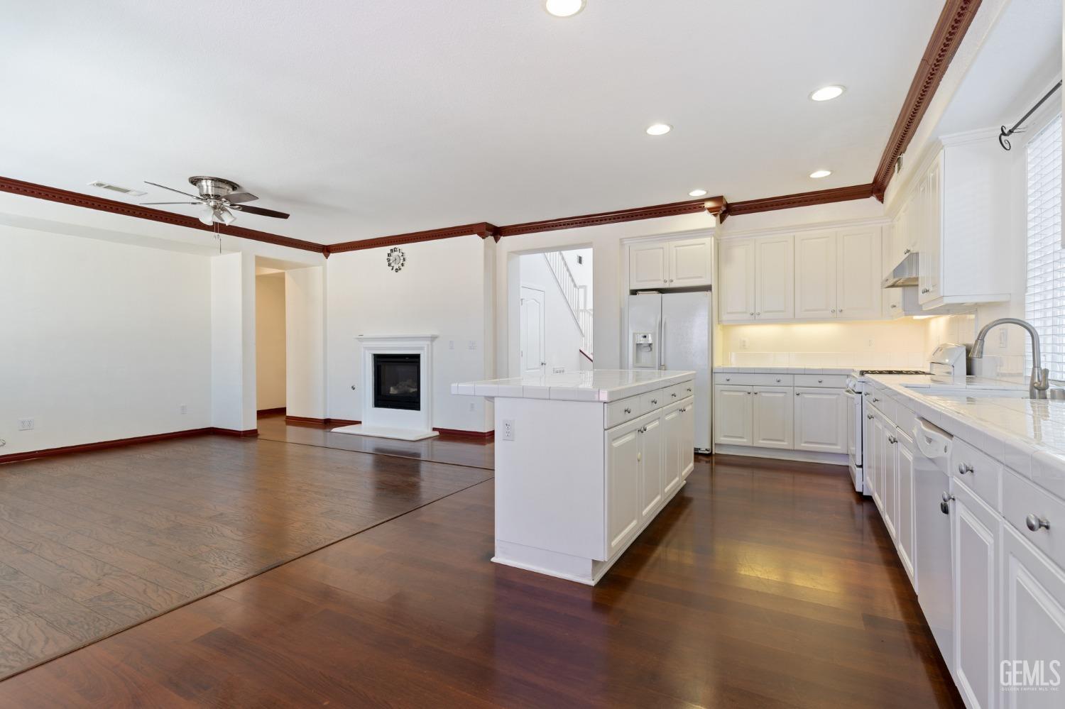 Undisclosed Address Bakersfield, CA 93306 - Photo 10 of 30 a view of a kitchen with a sink and a refrigerator