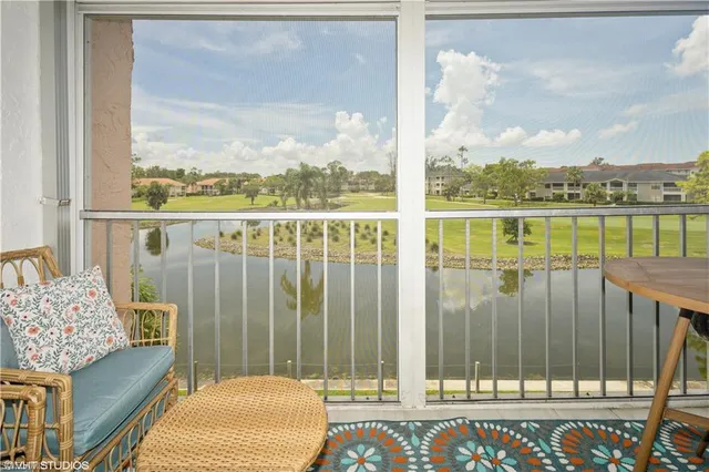 a balcony view with a lake view