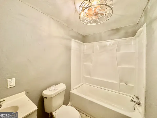 a view of a house with a yard and garage