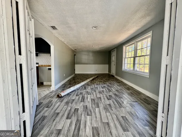 a view of a room with a large window