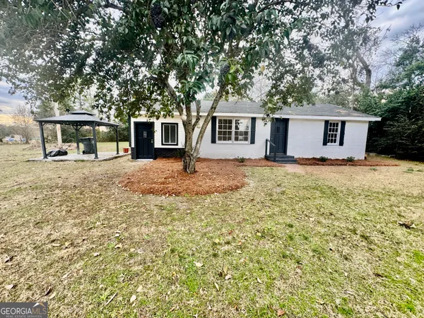 front view of a house with a yard