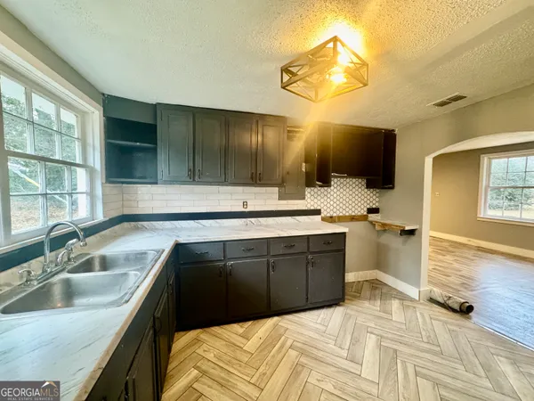 a living room with furniture and a table