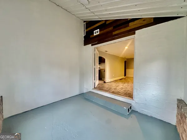 a living room with furniture window and wooden floor