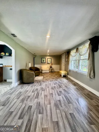a kitchen with a refrigerator and a sink