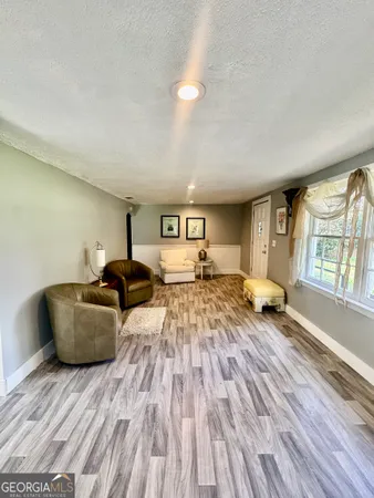 a bedroom with furniture and a window