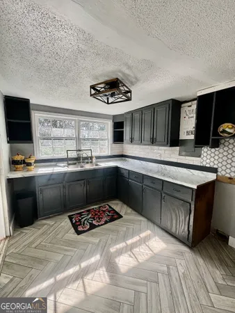 a bathroom with a toilet a sink and bathtub
