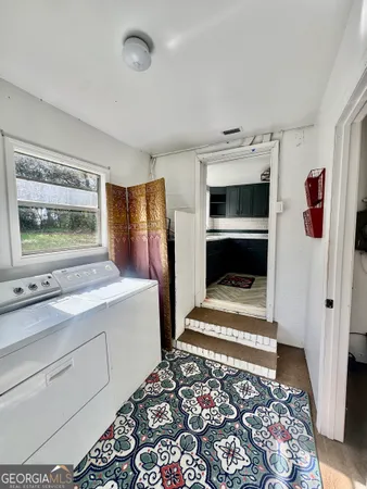 a kitchen with a stove kitchen island and sink