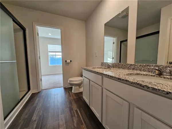 a kitchen with a refrigerator and a stove top oven