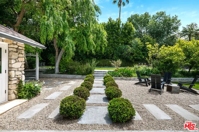 a view of a patio with chairs and a yard