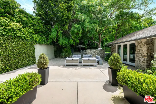 a view of a swimming pool with a garden