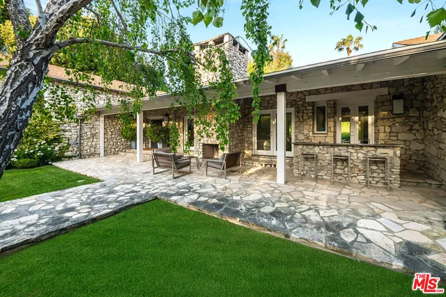 a view of house with outdoor seating space