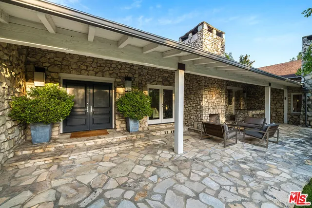 a view of living room with furniture and wooden floor