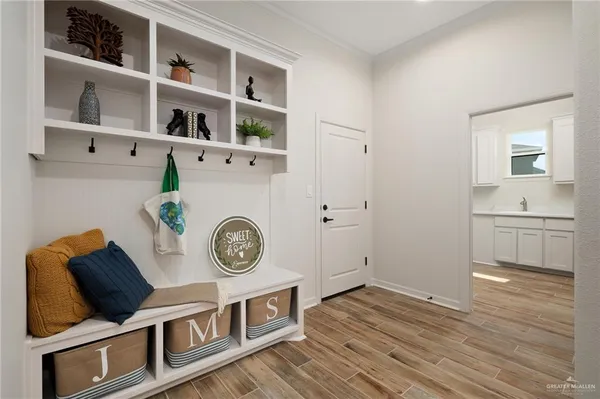 a view of a livingroom with furniture and wooden floor