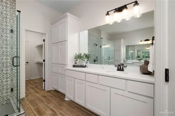 a bathroom with a sink and mirror