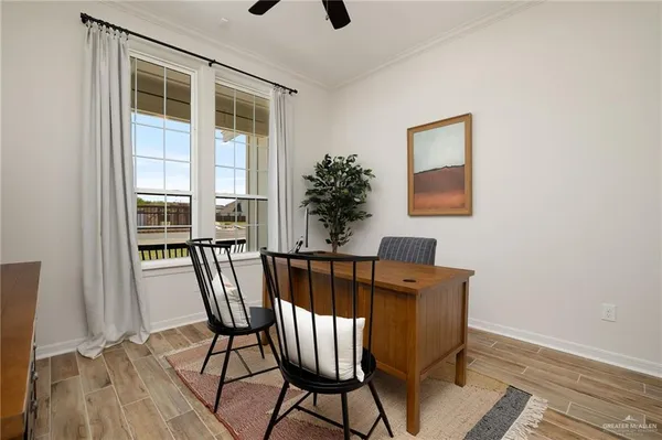 a view of a dining room with furniture window and wooden floor