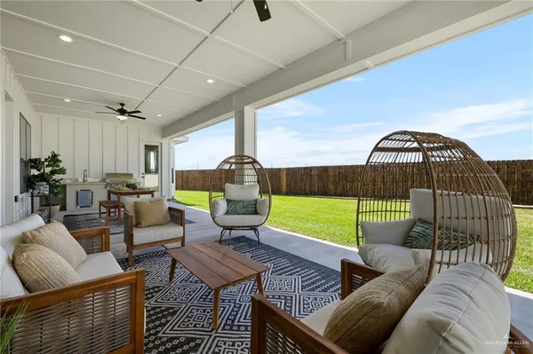 a living room with furniture and a gate