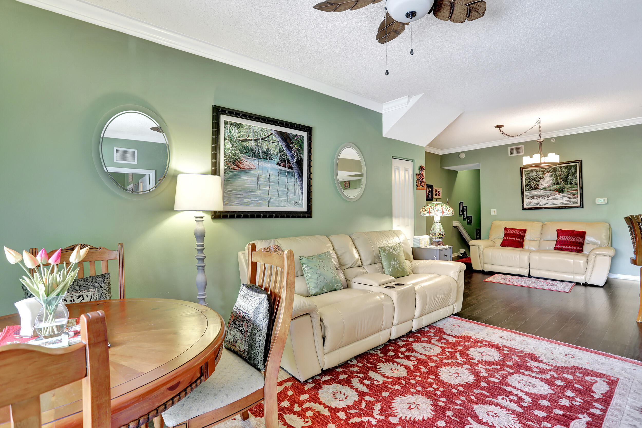 5800 West Sample Road, Unit 206 Coral Springs, FL 33067 - Photo 11 of 24 a living room with furniture and a rug