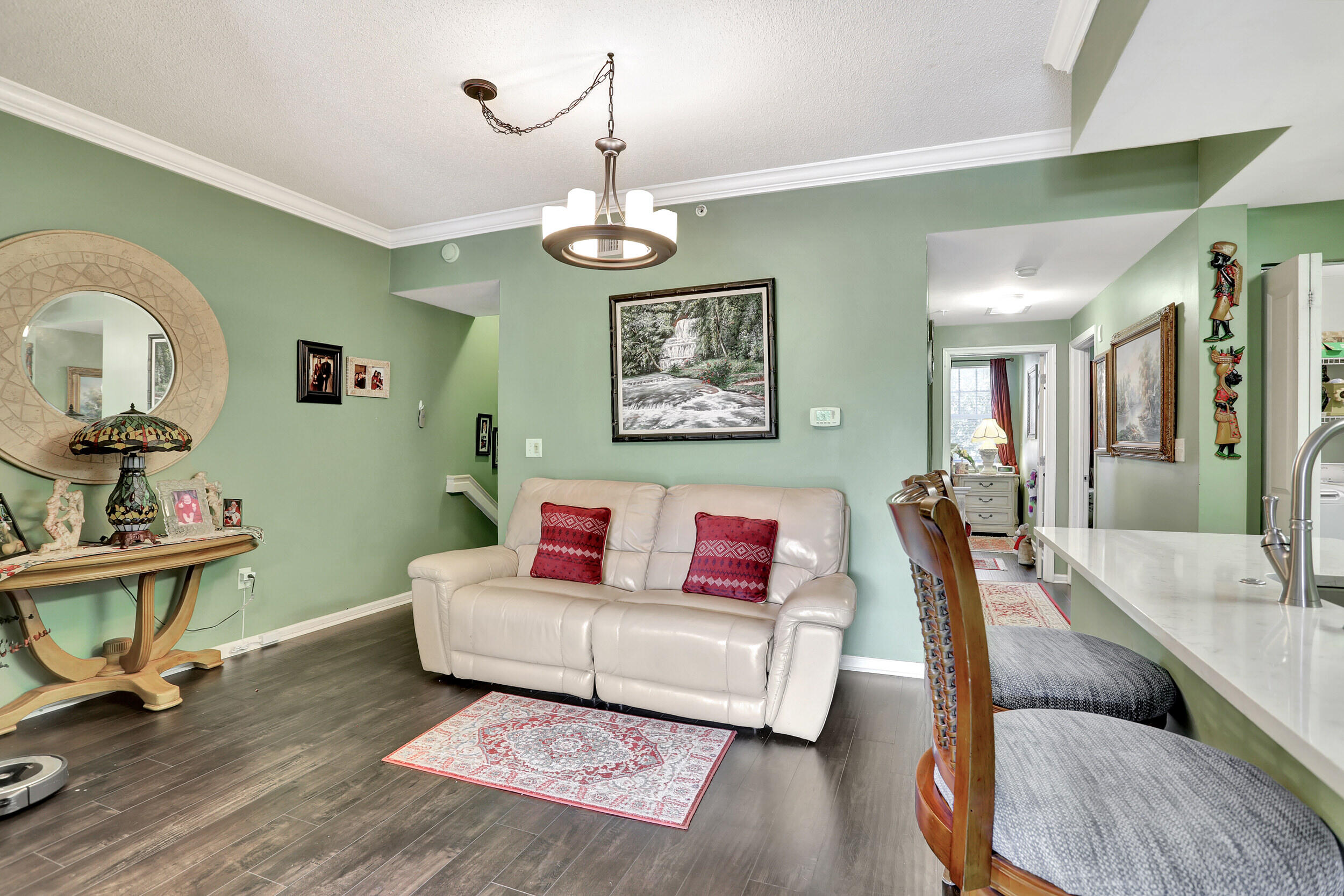 5800 West Sample Road, Unit 206 Coral Springs, FL 33067 - Photo 12 of 24 a living room with furniture piano and a table