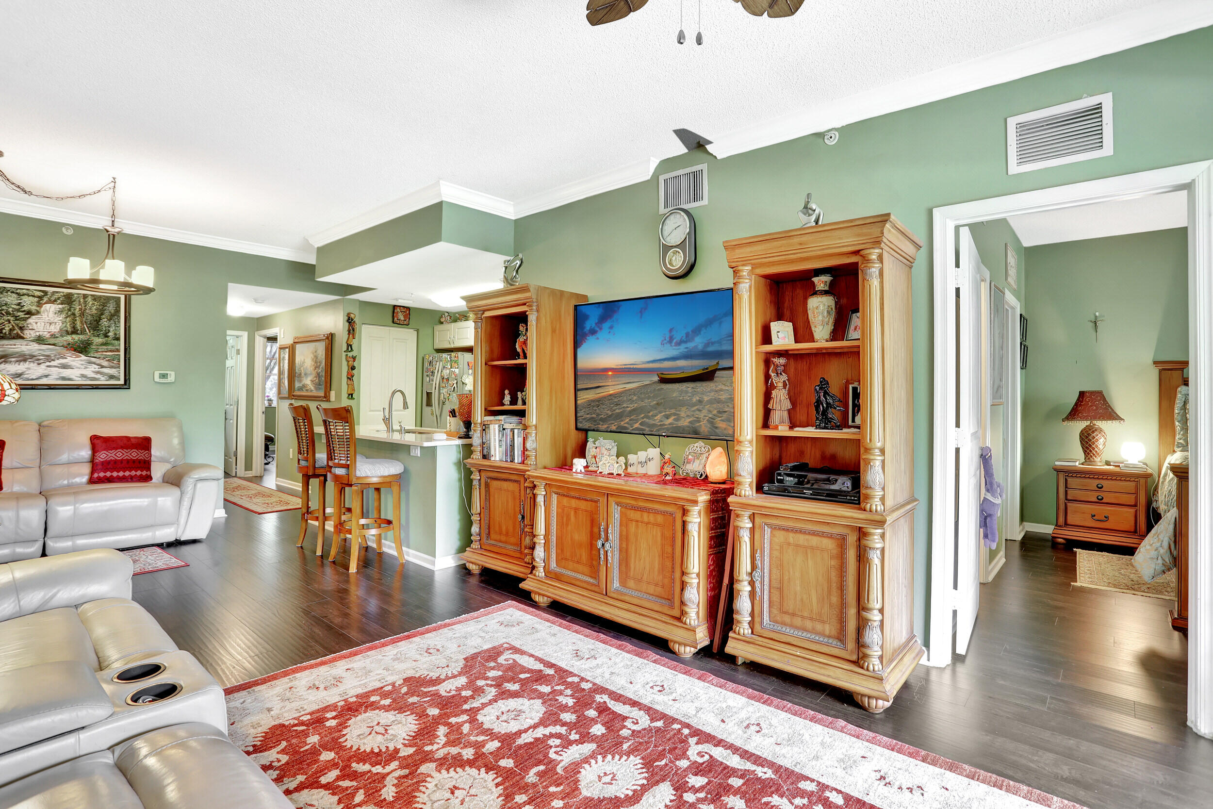 5800 West Sample Road, Unit 206 Coral Springs, FL 33067 - Photo 13 of 24 a living room with stainless steel appliances kitchen island granite countertop furniture and a view of living room