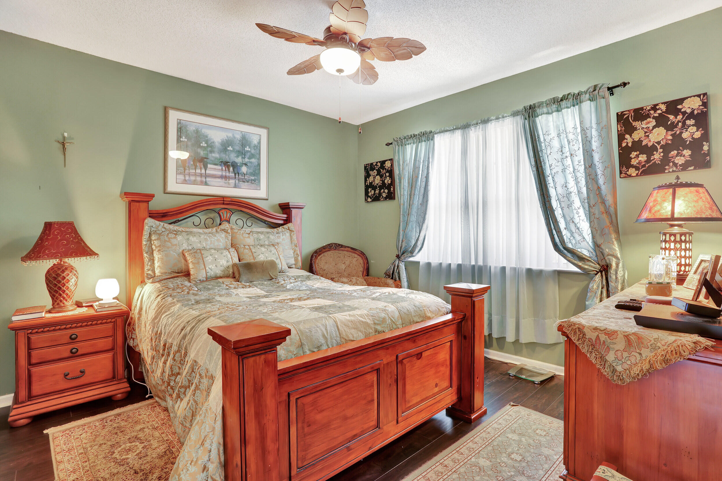 5800 West Sample Road, Unit 206 Coral Springs, FL 33067 - Photo 14 of 24 a bedroom with a bed and a dresser