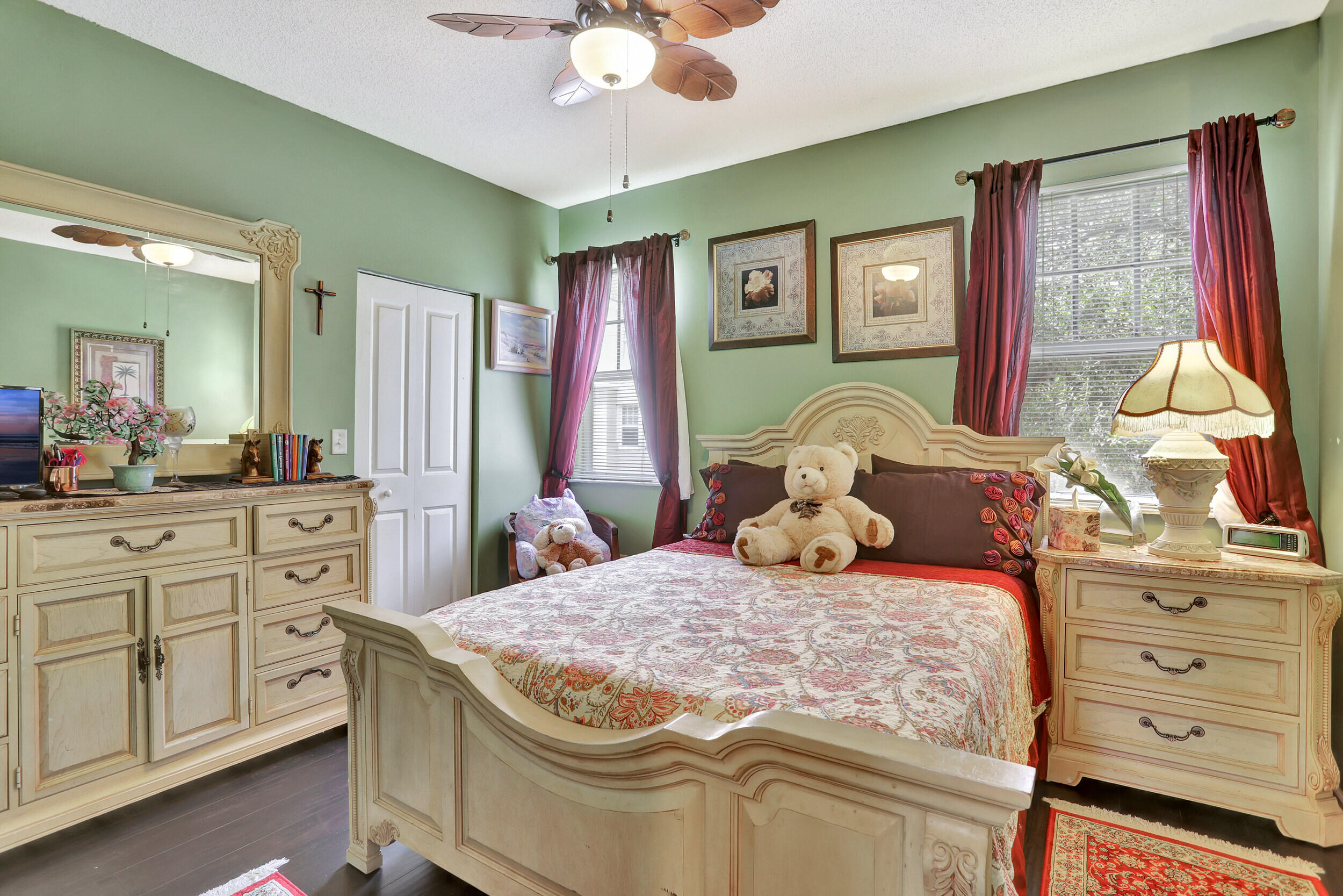 5800 West Sample Road, Unit 206 Coral Springs, FL 33067 - Photo 16 of 24 a bedroom with a bed and a dresser