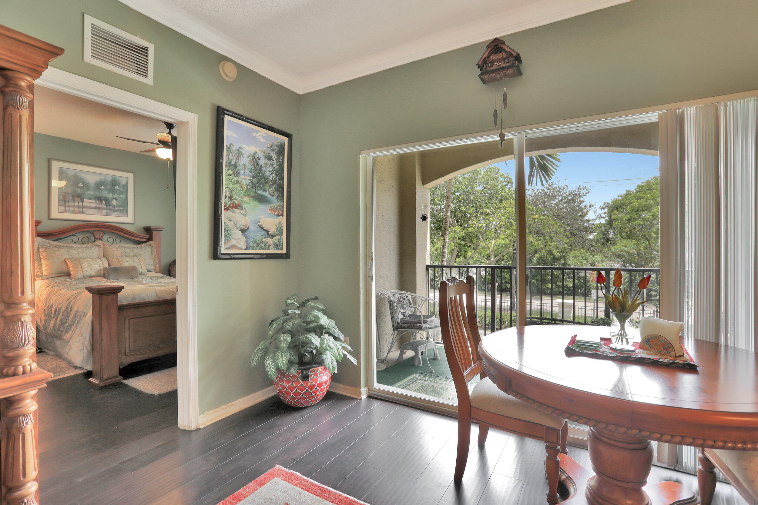 5800 West Sample Road, Unit 206 Coral Springs, FL 33067 - Photo 4 of 24 a very nice looking living room with a large window and wooden floor