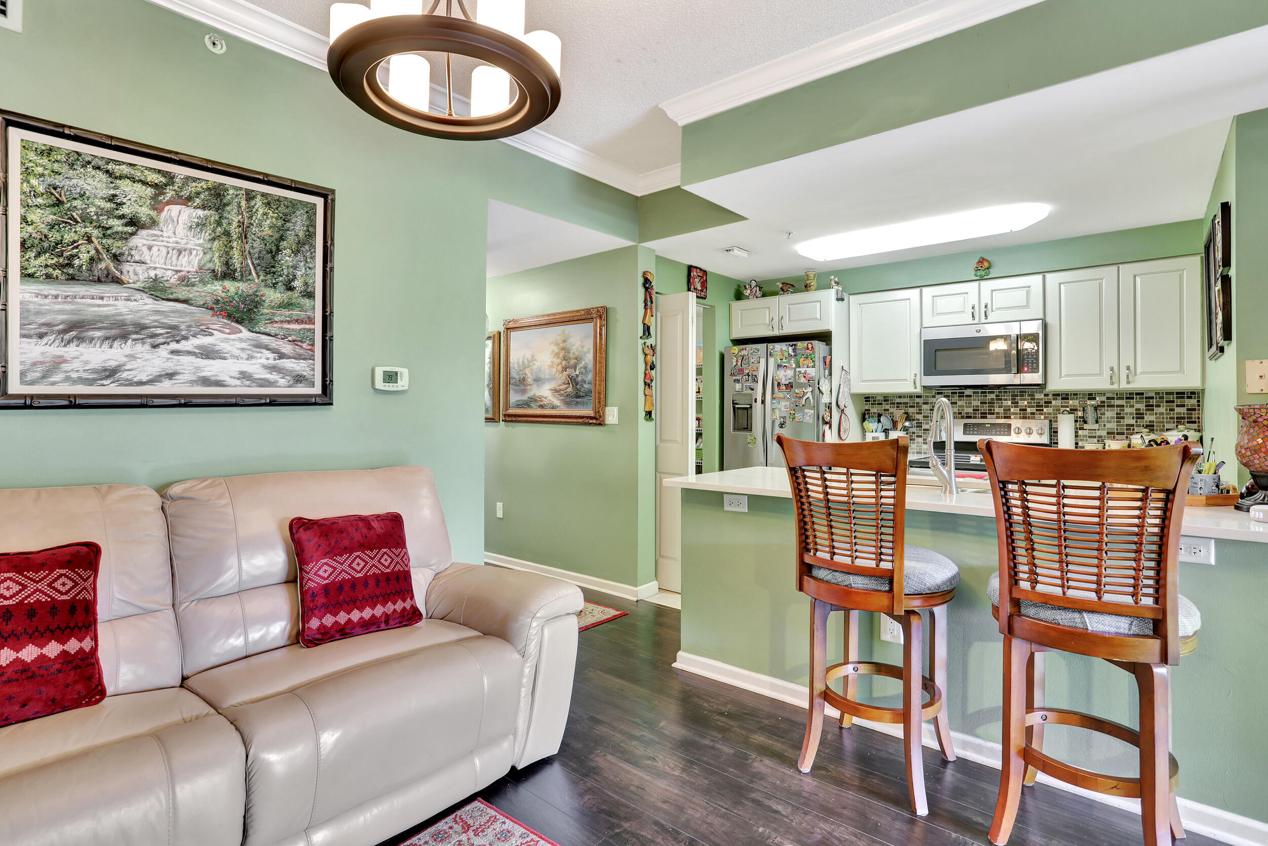 5800 West Sample Road, Unit 206 Coral Springs, FL 33067 - Photo 5 of 24 a living room with furniture and a wooden floor