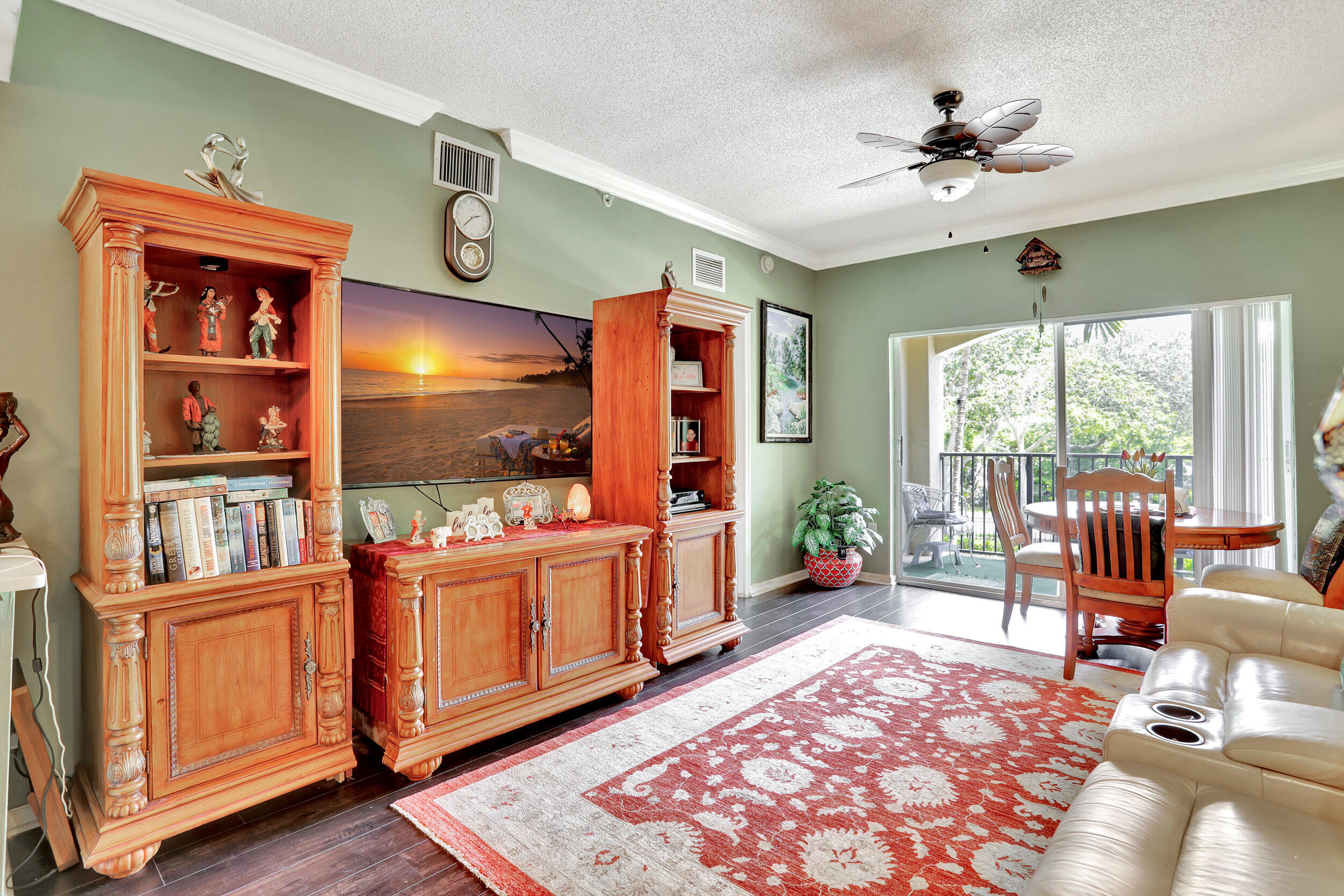 5800 West Sample Road, Unit 206 Coral Springs, FL 33067 - Photo 10 of 24 a living room with furniture and a flat screen tv