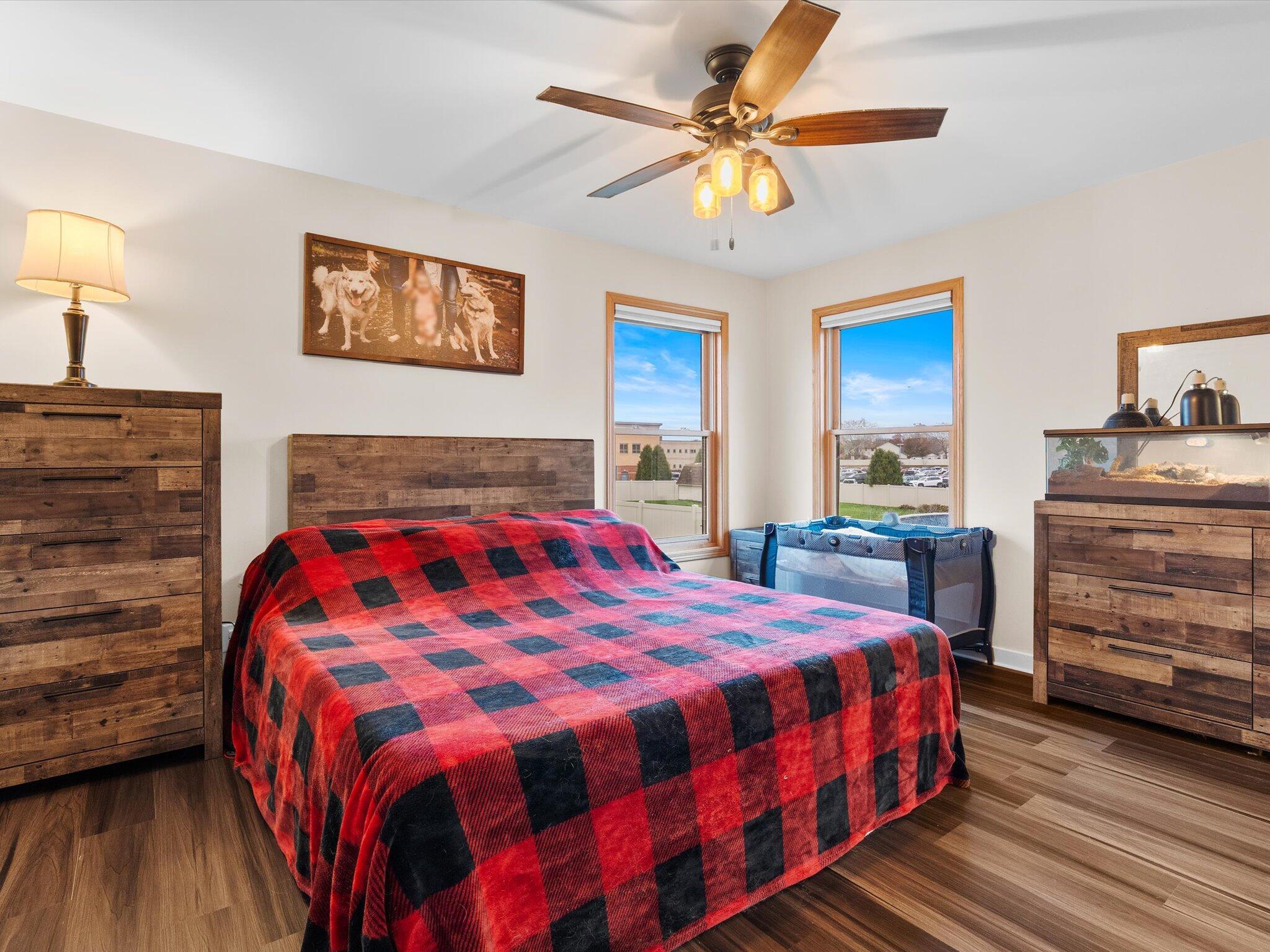 8407 Heron Lake Road St. John, IN 46373 - Photo 12 of 22 a bedroom with a bed and a dresser