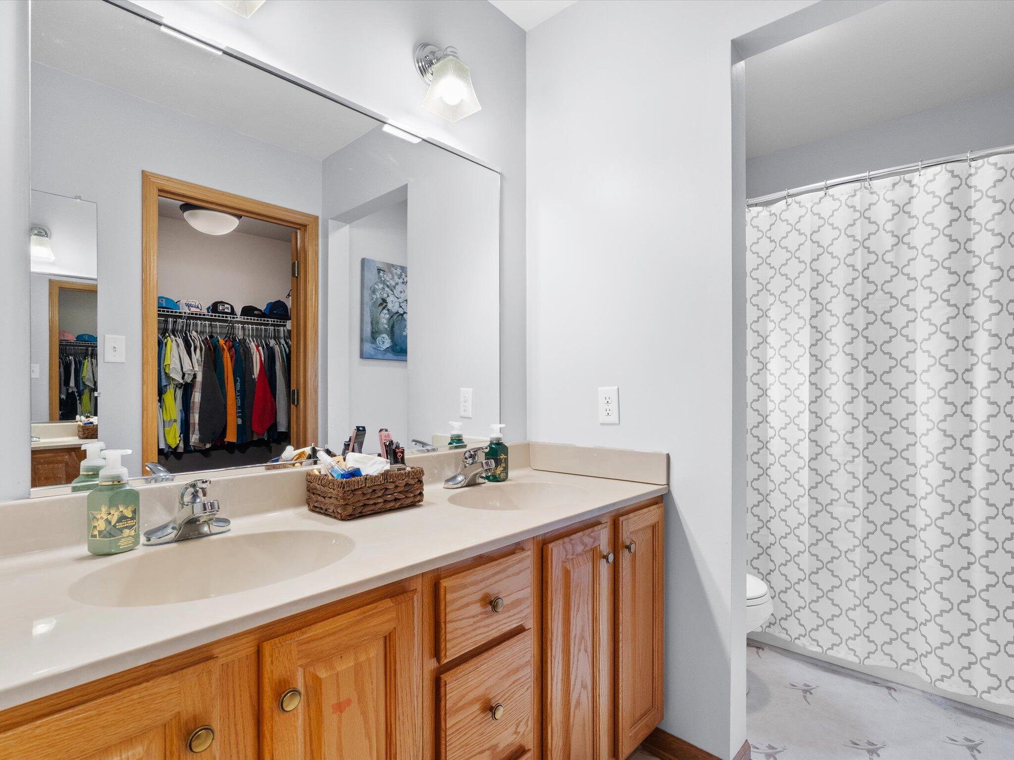 8407 Heron Lake Road St. John, IN 46373 - Photo 13 of 22 a bathroom with a sink and a mirror