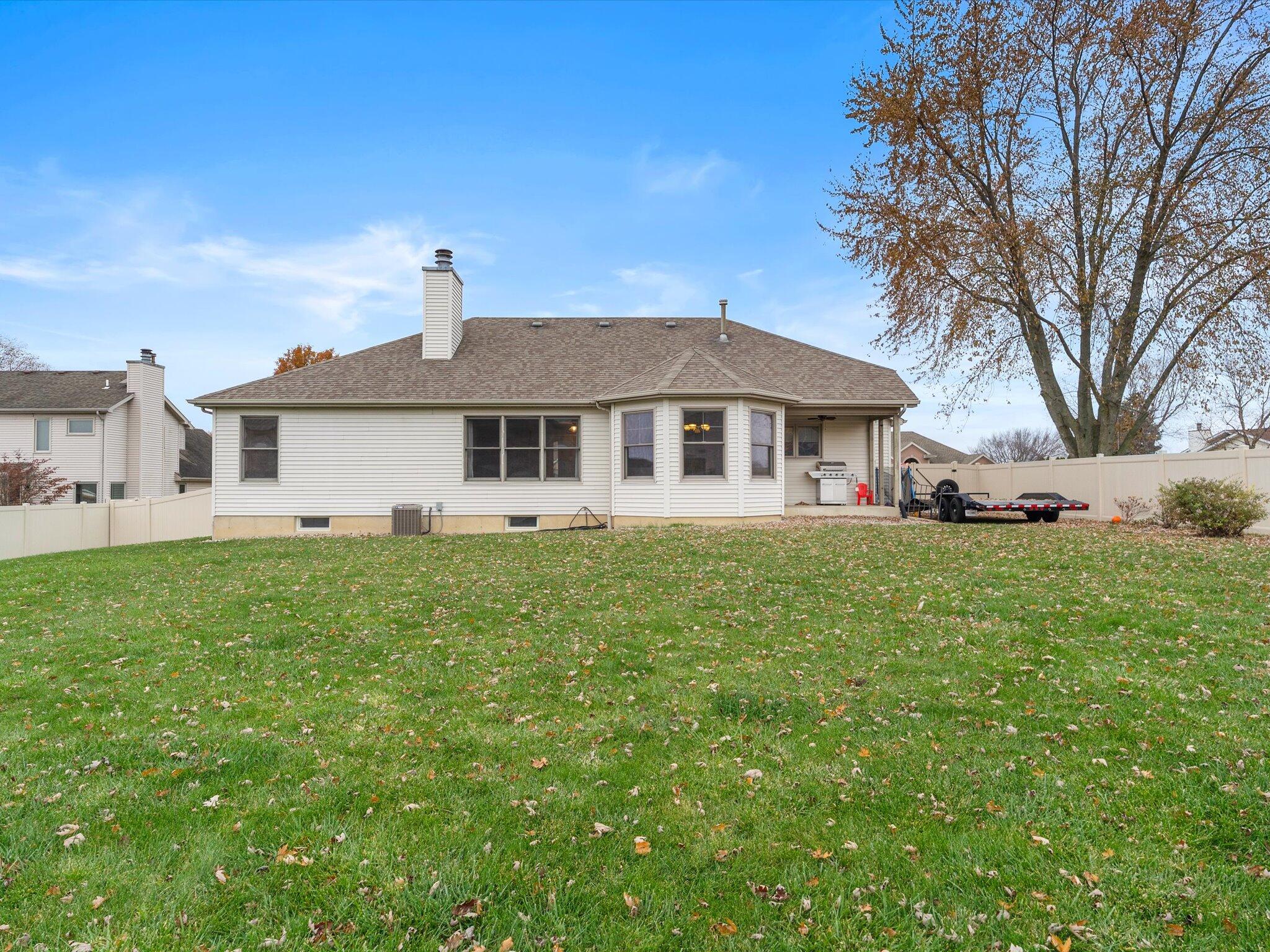 8407 Heron Lake Road St. John, IN 46373 - Photo 20 of 22 a front view of a house with a garden