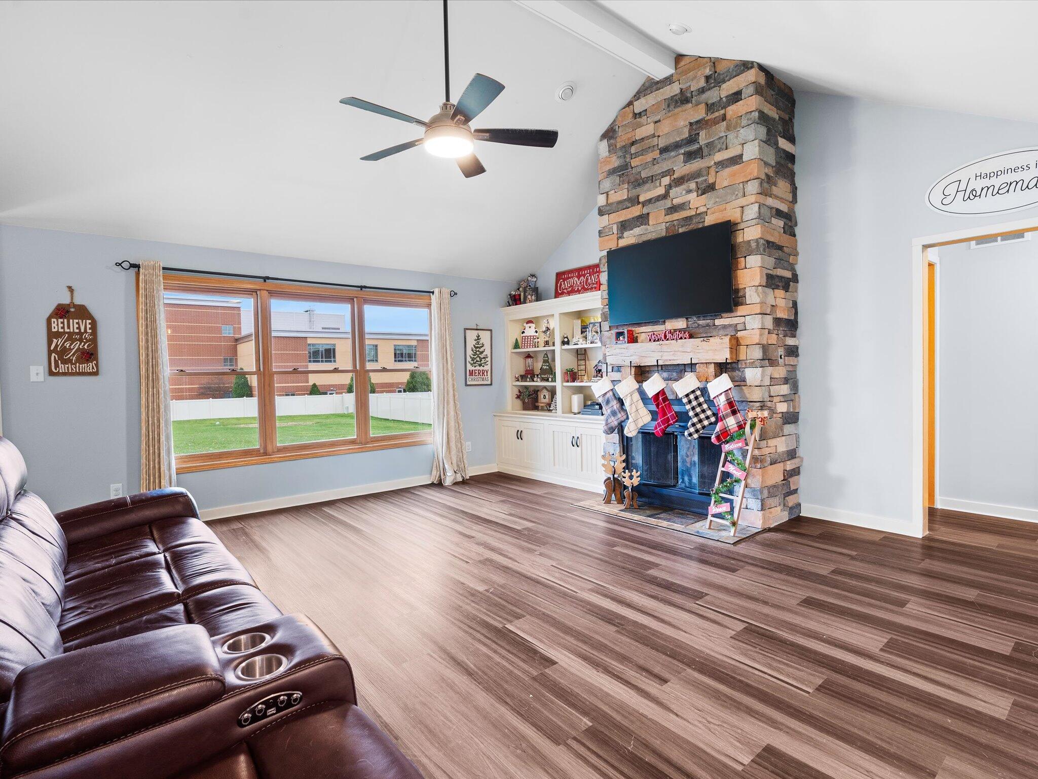 8407 Heron Lake Road St. John, IN 46373 - Photo 5 of 22 a view of a livingroom with hardwood floor and a ceiling fan