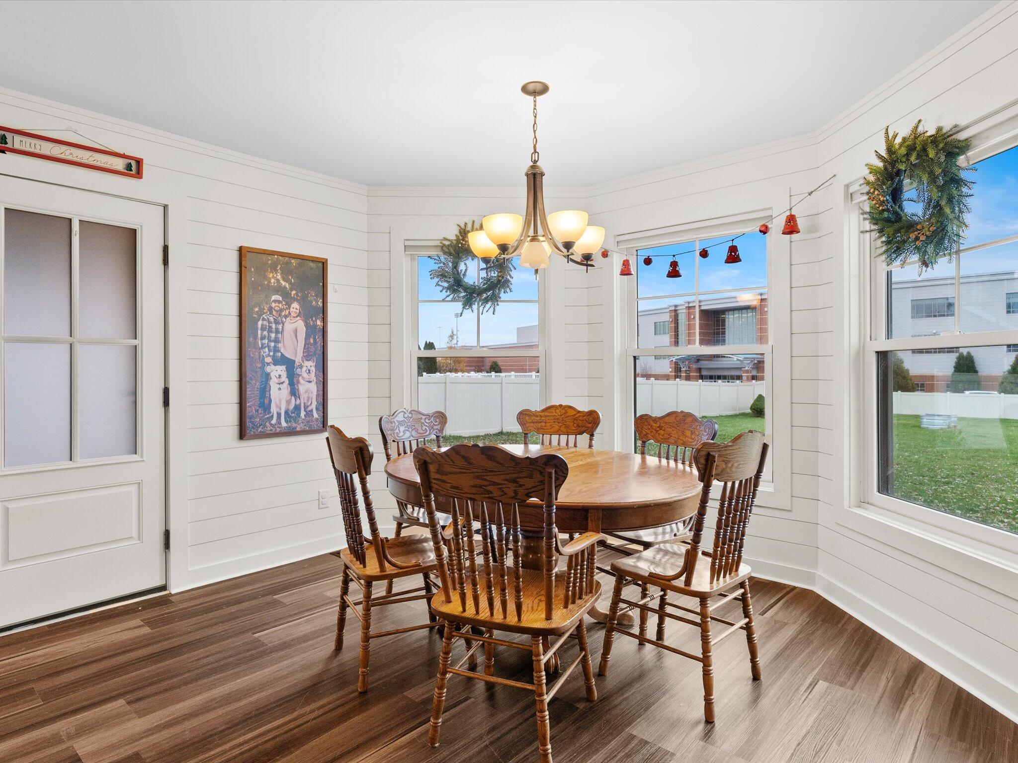 8407 Heron Lake Road St. John, IN 46373 - Photo 8 of 22 a view of a dining room with furniture window and wooden floor