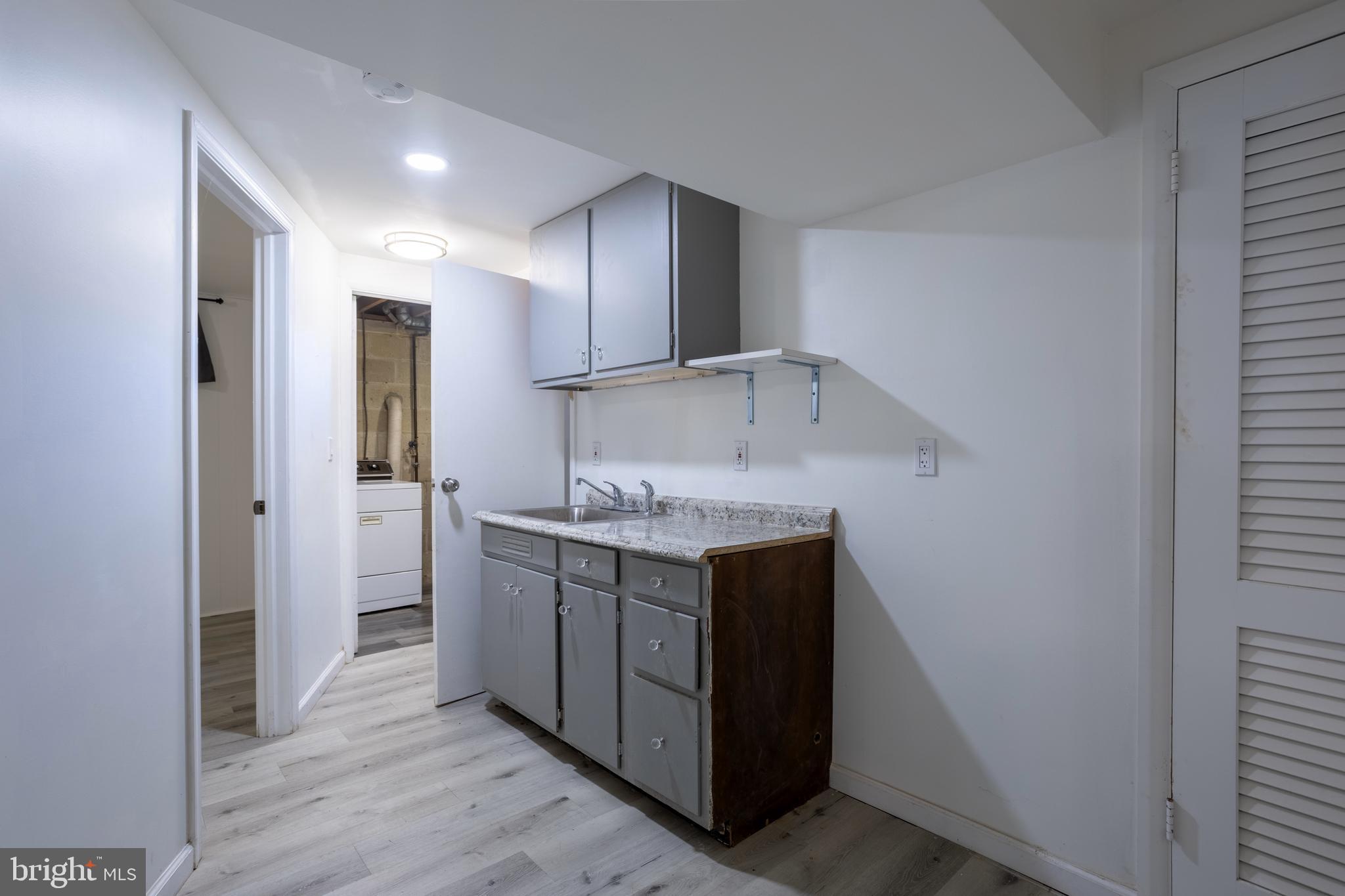 3207 Midfield Road Pikesville, MD 21208 - Photo 31 of 45 a bathroom with a granite countertop sink and a mirror