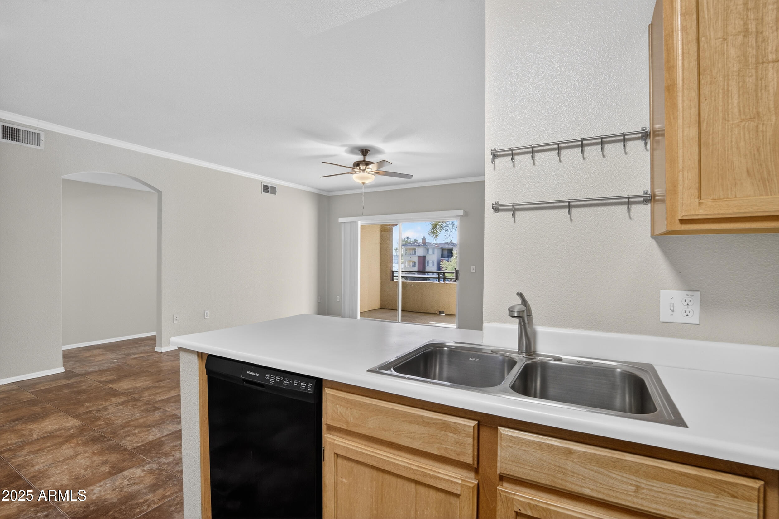 5401 East Van Buren Street, Unit 2076 Phoenix, AZ 85008 - Photo 13 of 41 a kitchen with a sink and cabinets