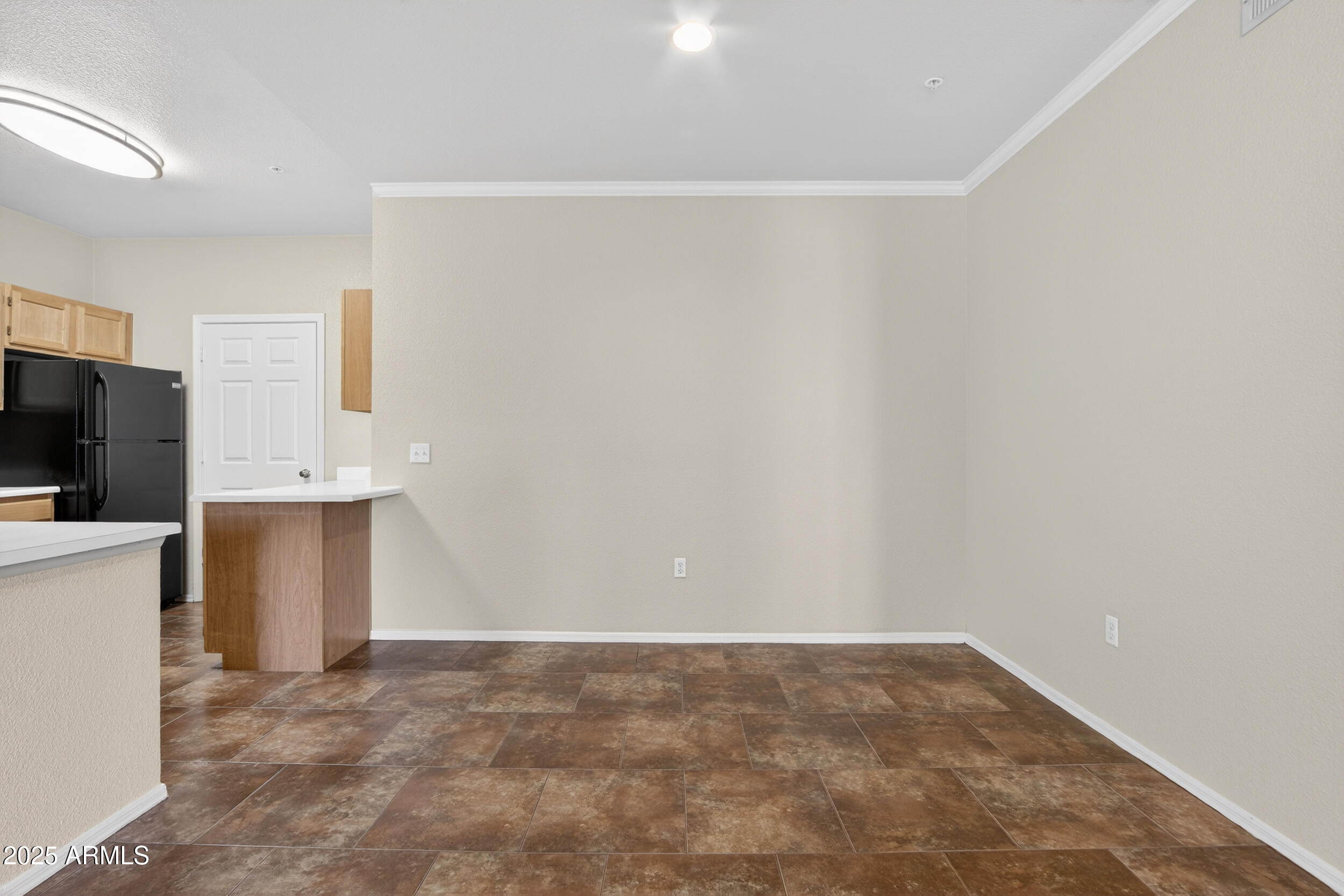 5401 East Van Buren Street, Unit 2076 Phoenix, AZ 85008 - Photo 15 of 41 a view of an empty room with a kitchen