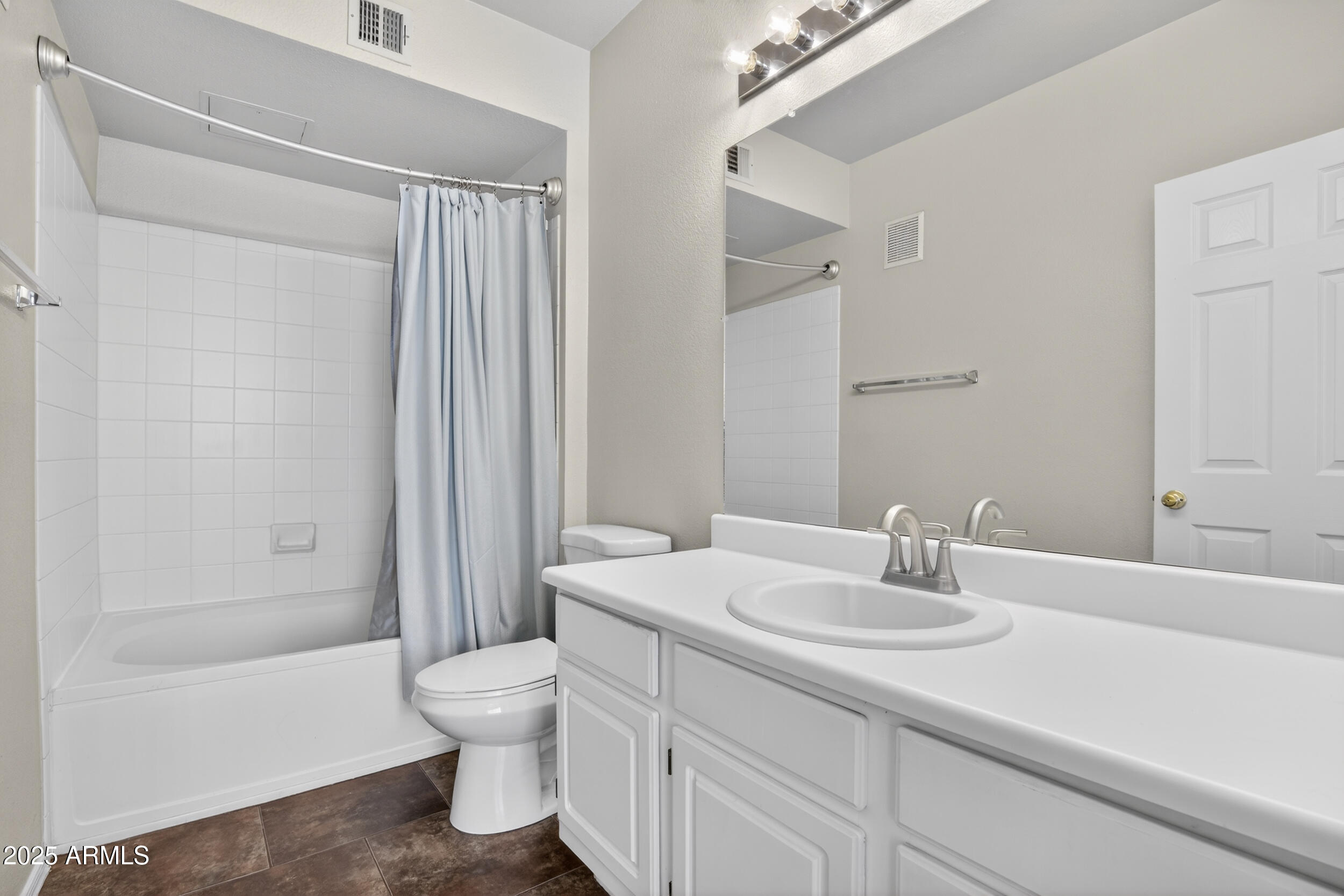 5401 East Van Buren Street, Unit 2076 Phoenix, AZ 85008 - Photo 21 of 41 a bathroom with a sink a toilet and shower