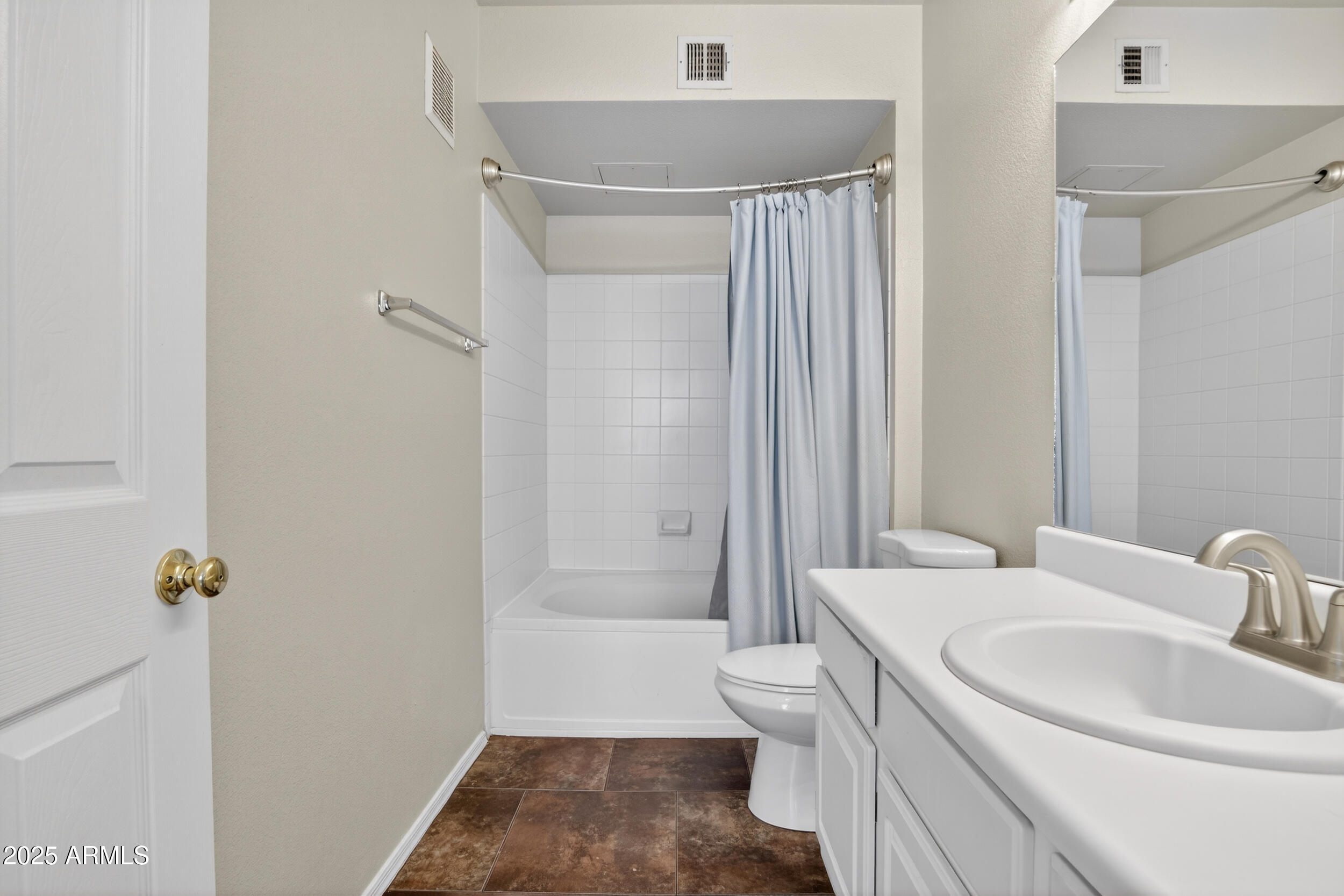 5401 East Van Buren Street, Unit 2076 Phoenix, AZ 85008 - Photo 22 of 41 a bathroom with a sink toilet and shower