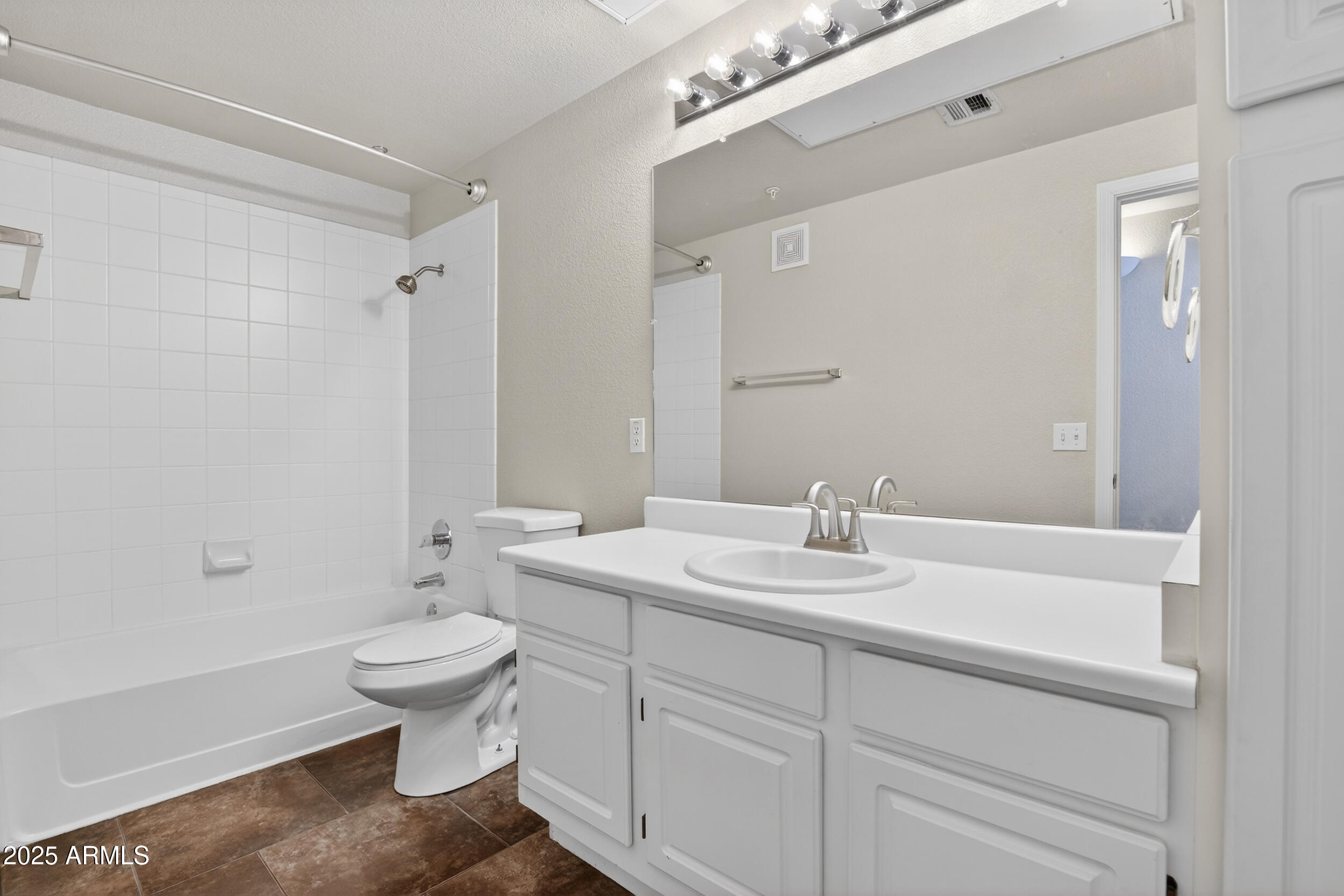 5401 East Van Buren Street, Unit 2076 Phoenix, AZ 85008 - Photo 25 of 41 a bathroom with a sink toilet and shower