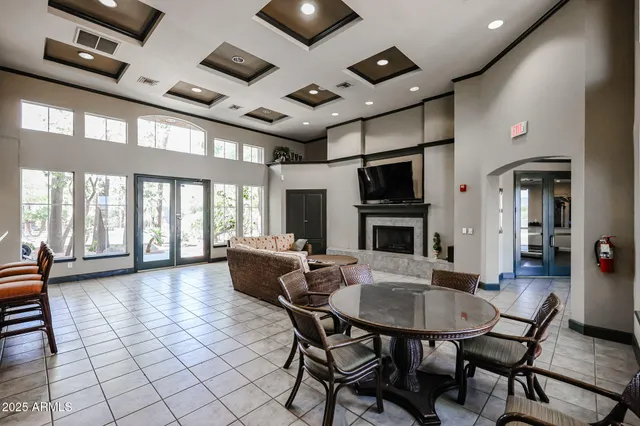 a swimming pool with outdoor seating