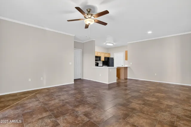 a view of a kitchen with a sink and a refrigerator